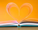 Open book with heart shaped pages
