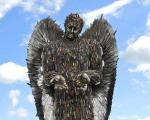 A photo of the Knife Angel, a 27-feet-tall statue created from over 100,000 knives and blades confiscated by the UK’s 43 police forces.