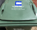A North Somerset Council garden waste bin with a 2022-23 permit attached.