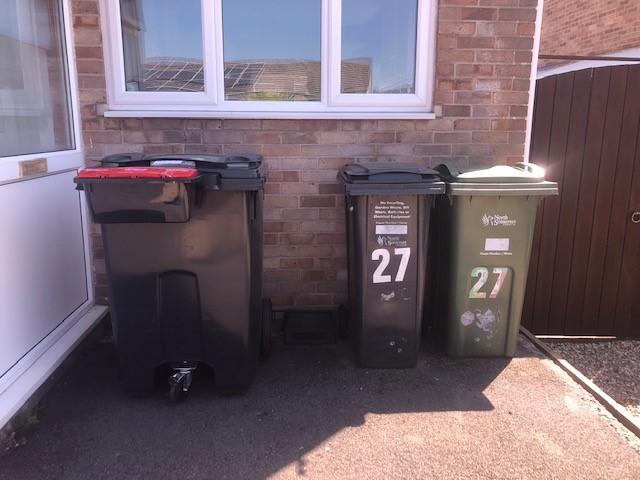 A Quatro bin stood next to regular household waste bins.