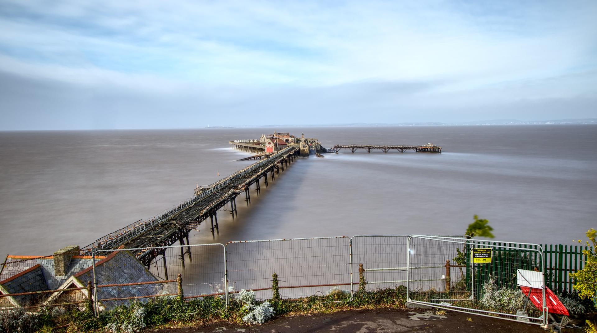 A photo taken of Birnbeck Pier from the road above looking out to sea
