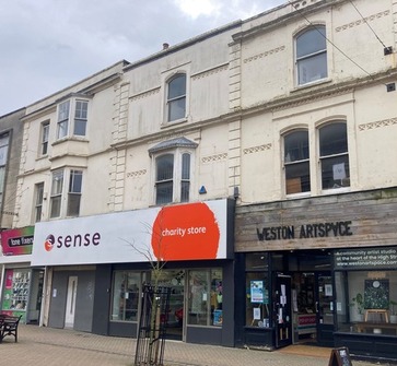 A photo of 67, 69, 71 and 73 High Street in Weston-super-Mare, currently a phone shop, charity shop and Weston Artspace