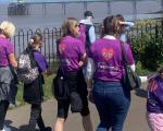 A photo taken of people walking  along Clevedon seafront to mark Foster Care Fortnight 2022