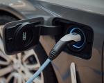 charging cable plugged in to electric car