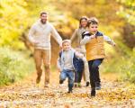 Family walking in autumn woods