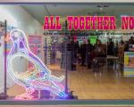 A photo to show the All Together Now exhibition display in the shopfront of unit 27 in the Sovereign