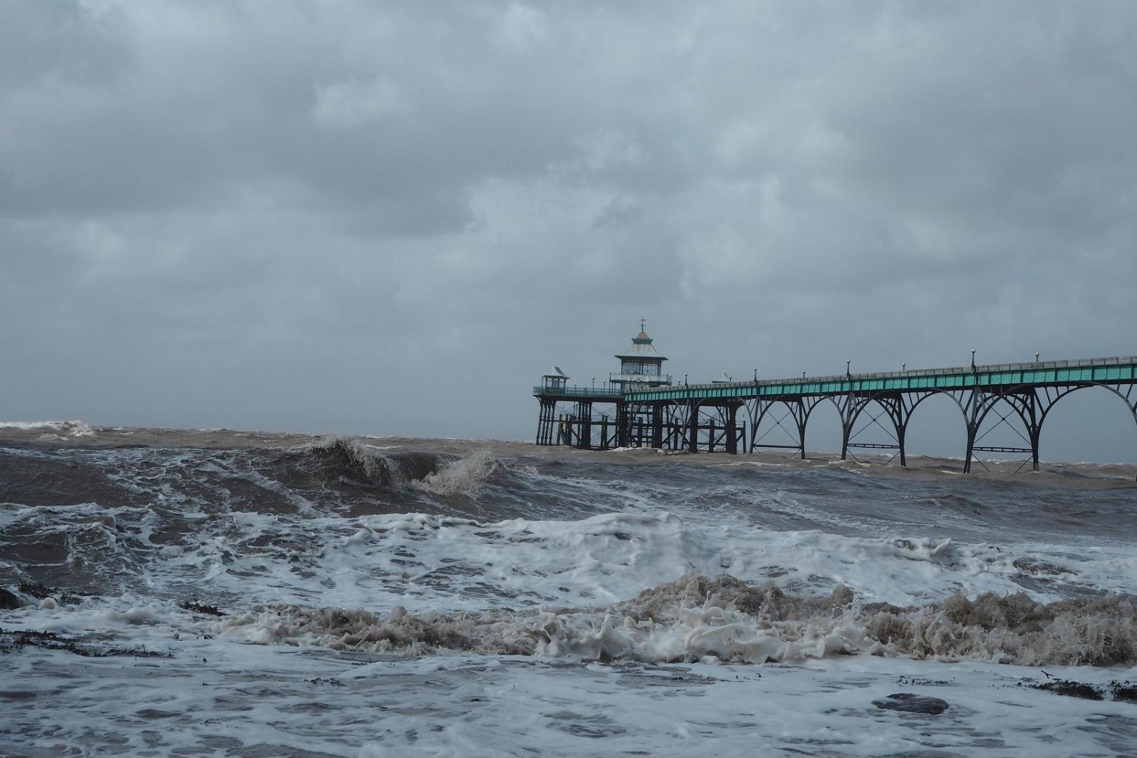 Clevedon Pier and a stormy sea with black clouds