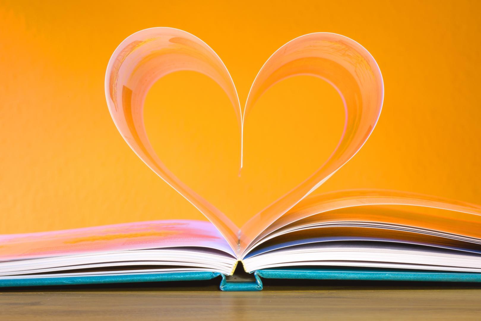 Open book with heart shaped pages