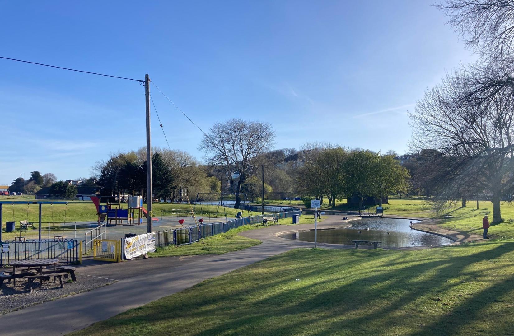 A photo of Portishead Lake Grounds showing the lake and children's play area