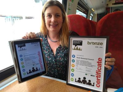 Cllr Bridget Petty with our bronze and silver Carbon Literacy award certificates